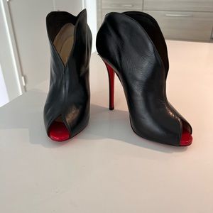 Christian Louboutin black peep toe booties.